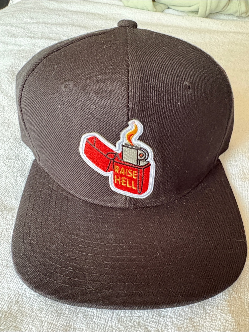 Black Snapback Hat with Red Lighter Patch - "Raise Hell"